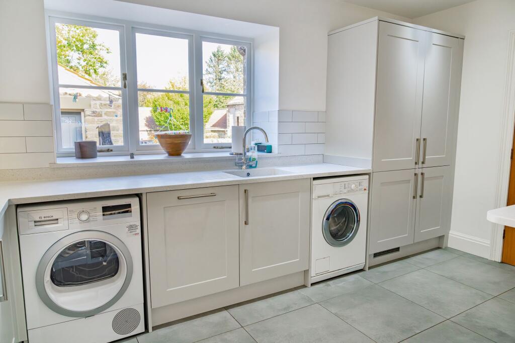 Integrated appliances and space for a washer and a dryer