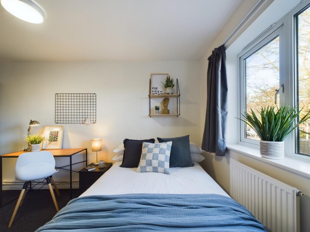 A bright and inviting double bedroom, perfect f...