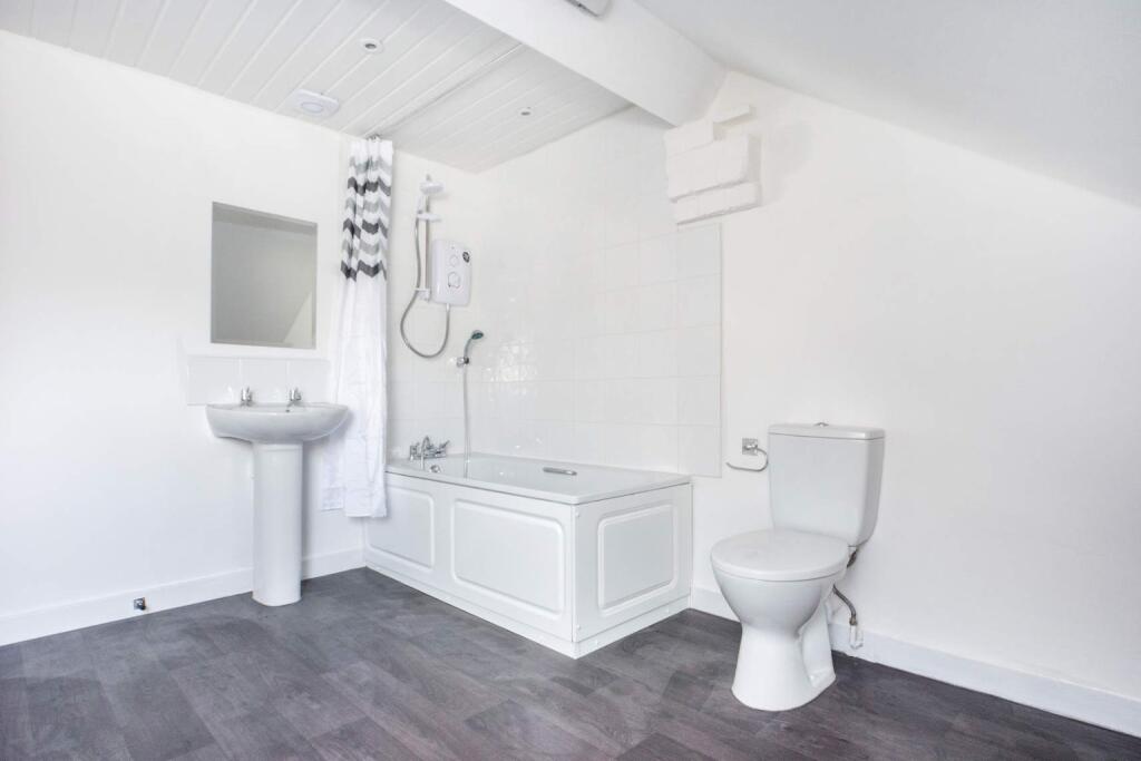 A bright and modern bathroom featuring a stylis...