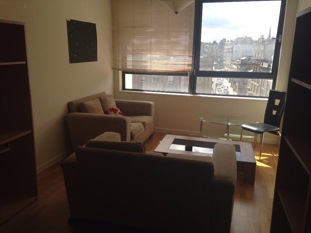 A cozy living room with comfortable seating and...