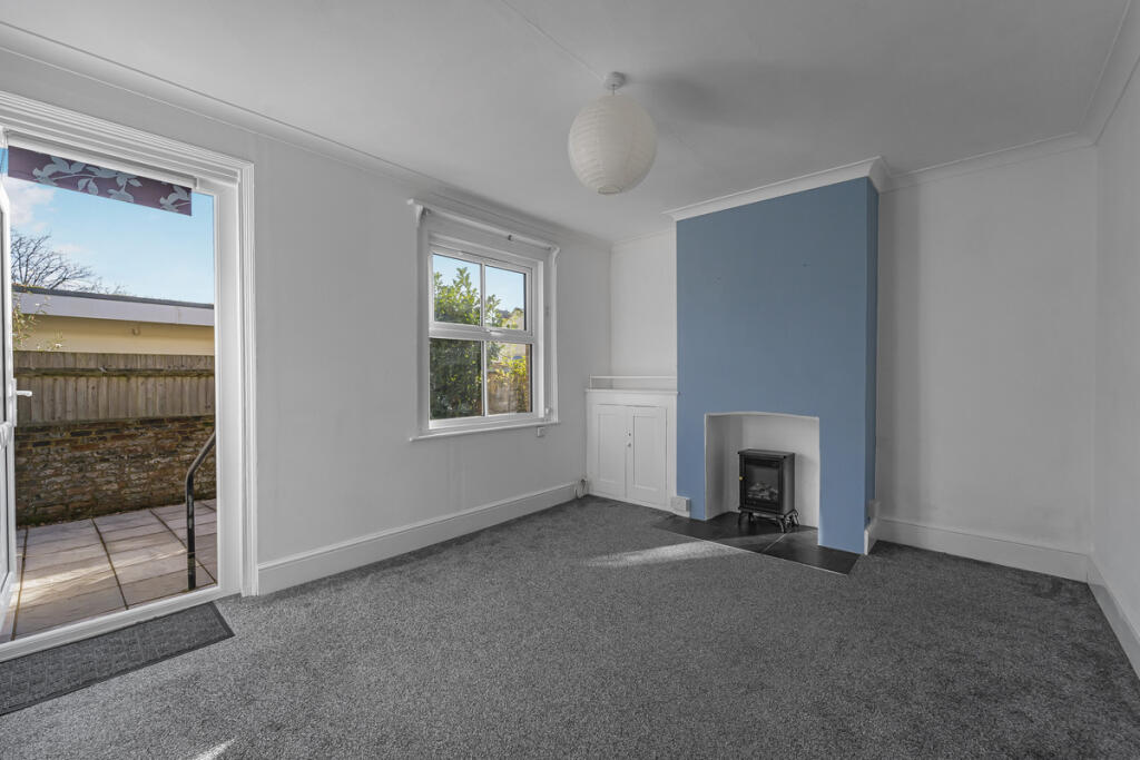 Living room with access onto the rear terrace