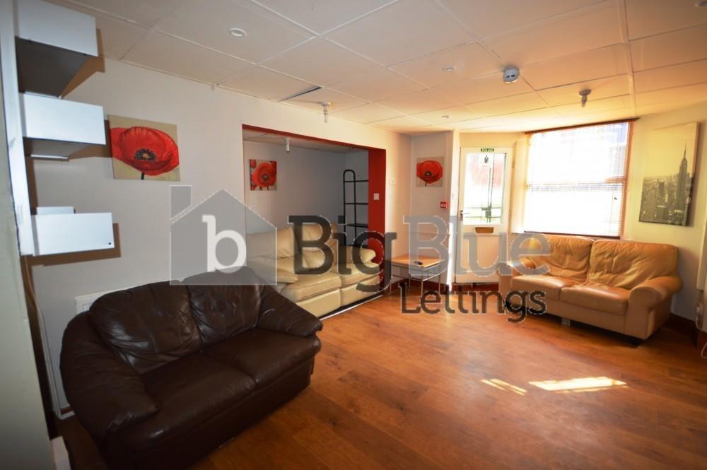 Bright and welcoming living room with warm wood...