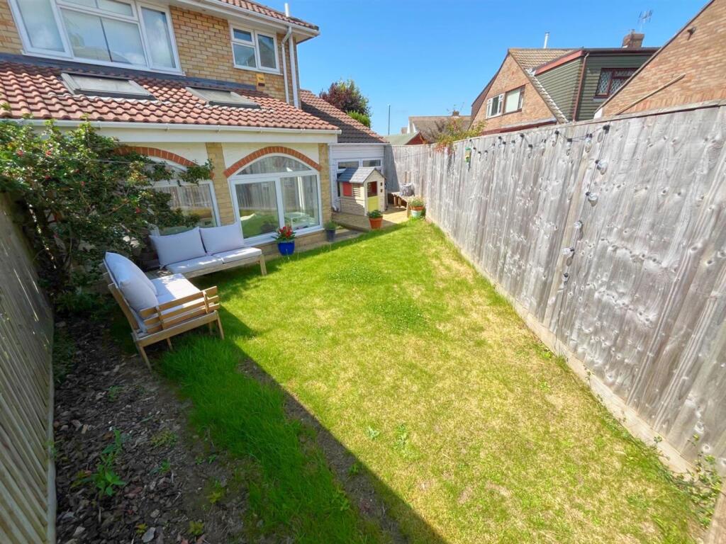 Rear view of property and patio.jpg